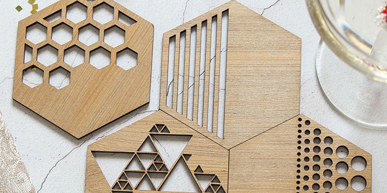 laser cutting art patterns into wooden coasters