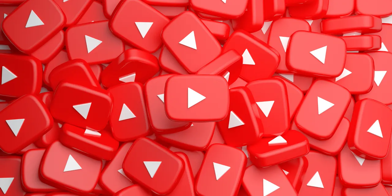 Pile of 3D red YouTube play buttons symbolizing video content and media streaming