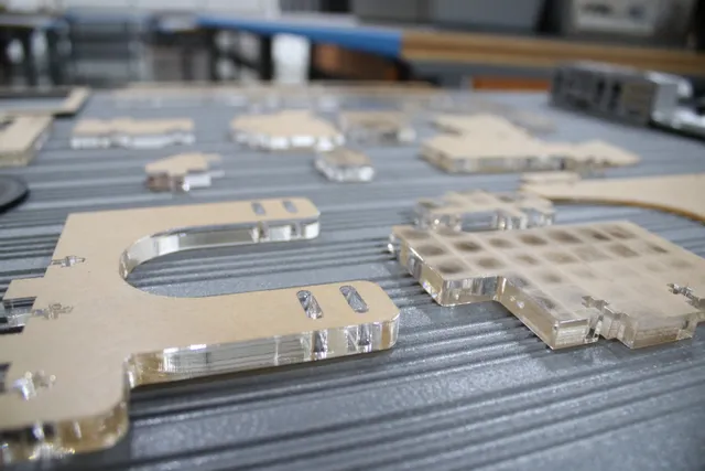 Laser-cut acrylic parts on Trotec Speedy series CO₂ laser cutter bed