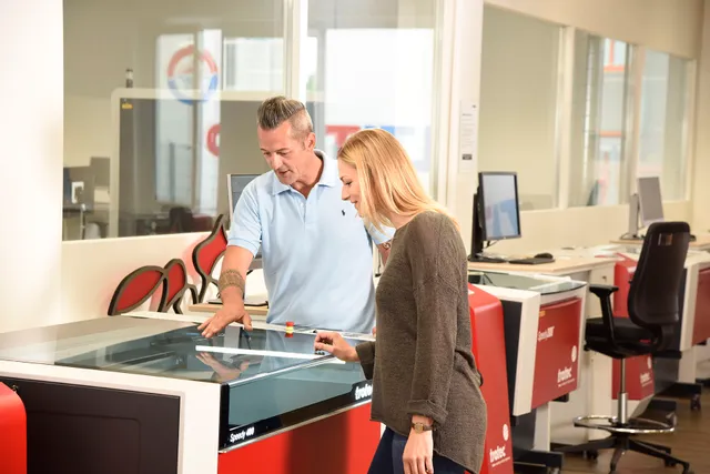 Trotec Speedy 400 CO₂ laser cutter demonstration in modern workspace