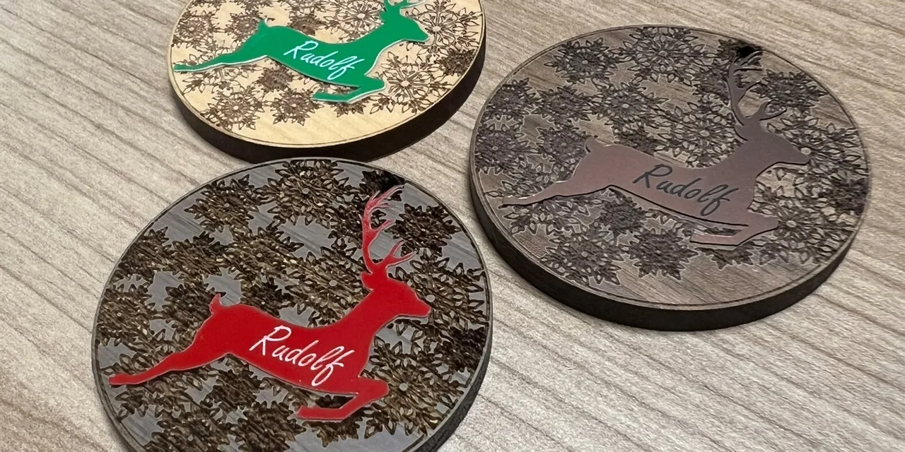 Trotec laser cutter engraved wooden ornaments with reindeer design and Rudolf text
