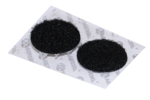 Two self-adhesive black Velcro hook-and-loop circles on branded Aerochao backing