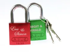 Colorful ABUS padlocks engraved with names using Trotec laser engraving machine