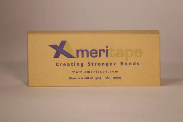 Laser-engraved Ameritape logo and contact info on cardboard using Trotec laser marking technology