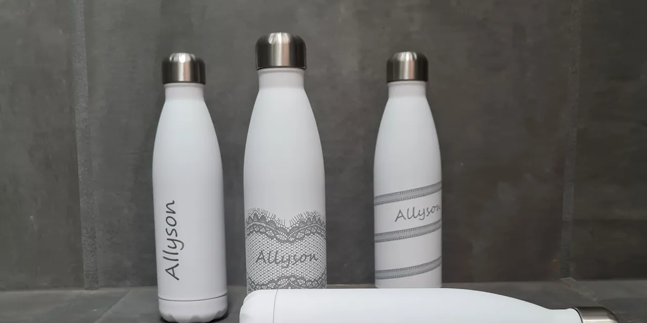 White metal bottles engraved with name Allyson using Trotec laser marking technology