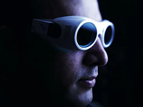 Close-up of person wearing protective laser safety glasses for Trotec laser cutter operation