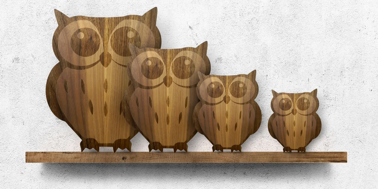 Laser-cut wooden owl figures created with Trotec CO₂ laser engraving machine