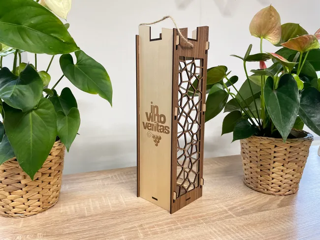 Laser-cut wooden wine box with in vino veritas design created using Trotec CO₂ laser cutter