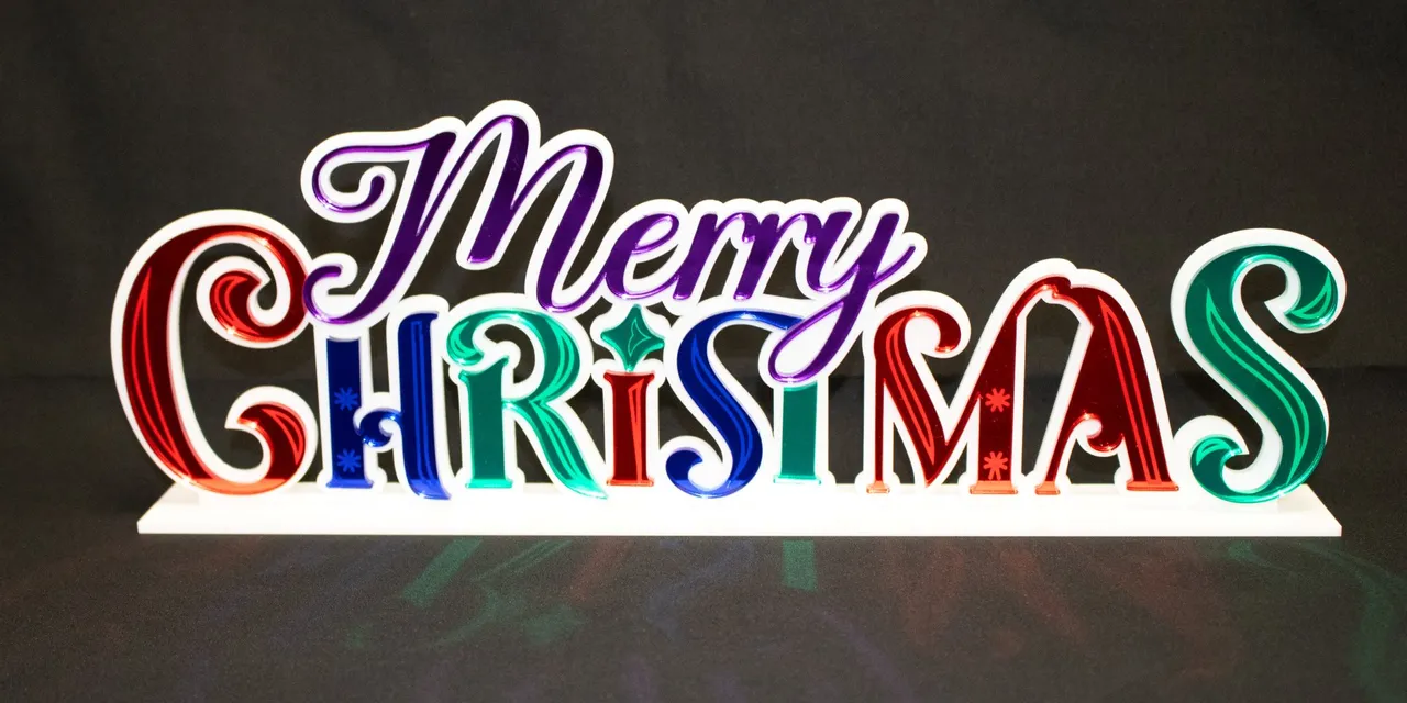 Colorful acrylic Merry Christmas sign cut with Trotec laser cutter