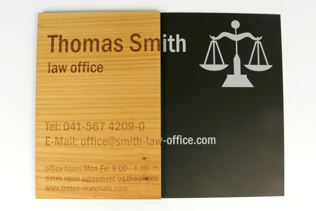 Laser-engraved wooden and plastic law office signs made with Trotec laser engraving machine