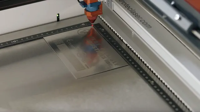 Trotec laser cutter engraving detailed marking on metal plate with precision