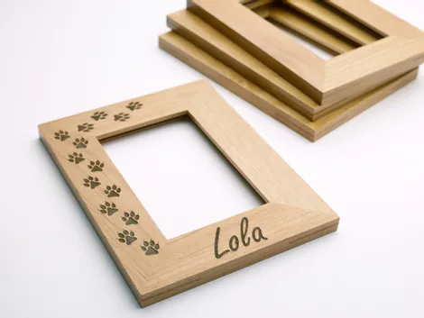 Wooden photo frame laser engraved with paw prints and name using Trotec Speedy series CO₂ laser engraver
