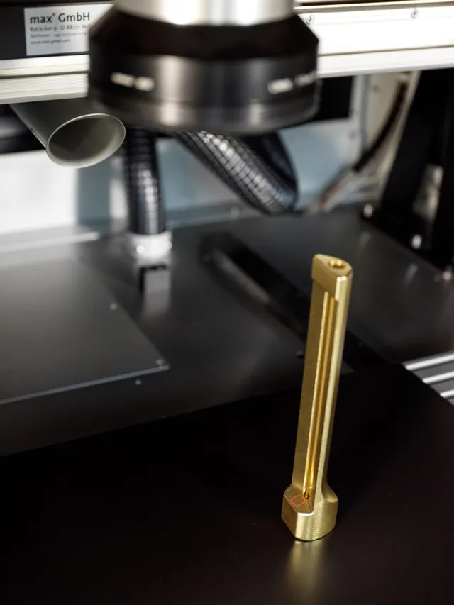 Trotec SpeedMarker laser marking a brass tool with precise engraving