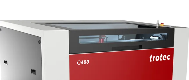 Trotec Q400 CO₂ laser cutter with enclosed work area on wheeled base