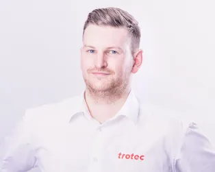 Trotec team member in branded shirt representing laser engraving and cutting technology