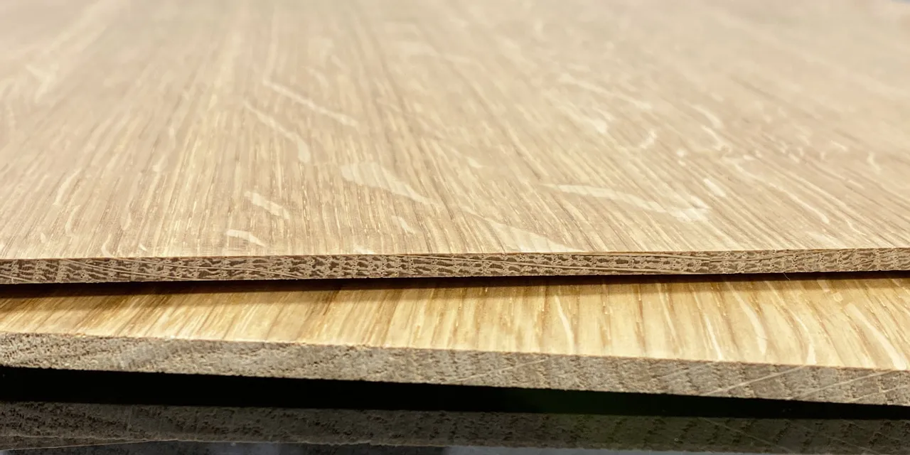 Close-up of laminated wood sheets compatible with Trotec laser cutters for precise engraving or cutting