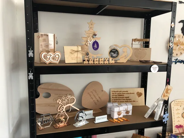 Laser-cut and engraved wooden and acrylic gifts made with Trotec laser cutter on display shelf