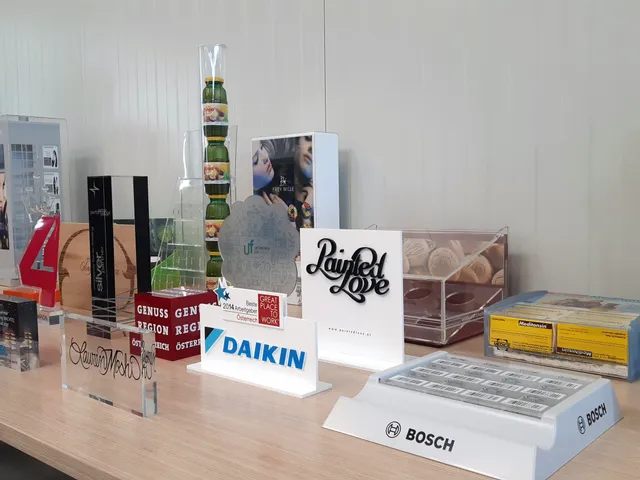 Various acrylic and wood laser engraved awards and signage made with Trotec laser cutter