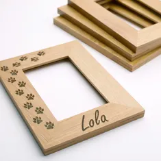 Wooden photo frame laser engraved with paw prints and name using Trotec Speedy series CO₂ laser engraver