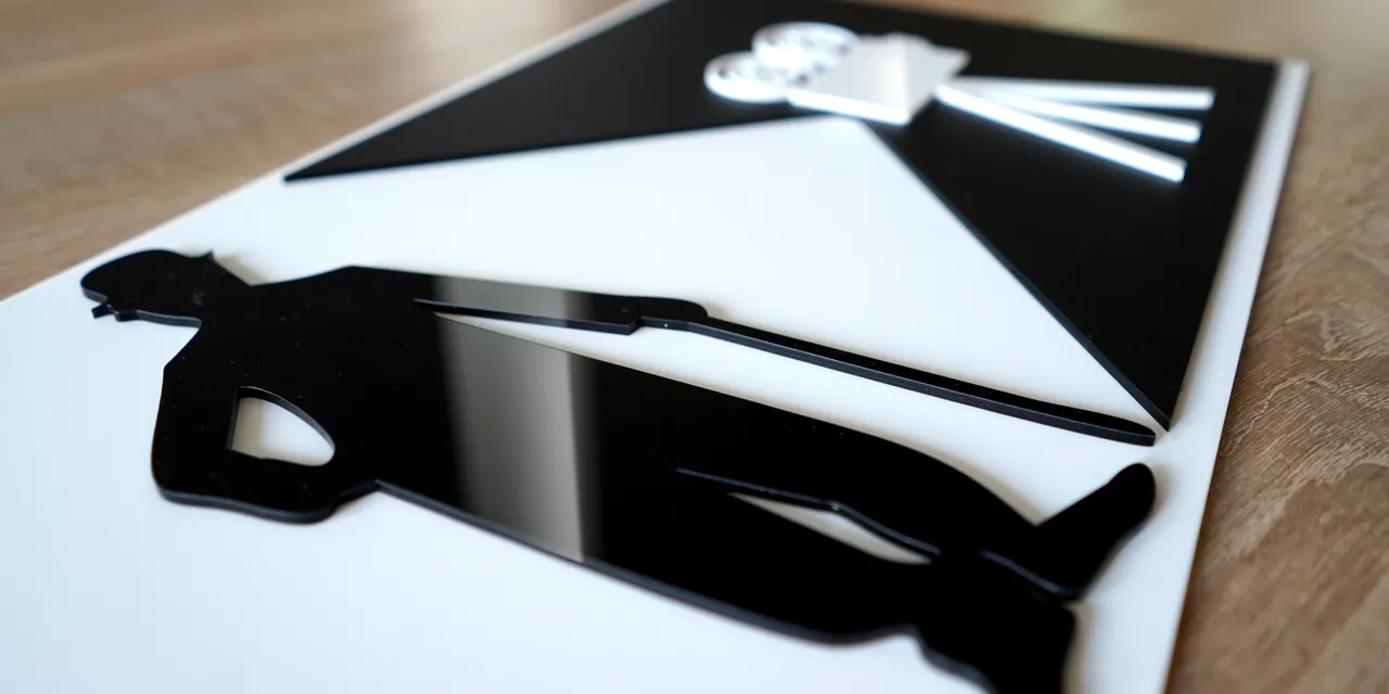 Laser-cut acrylic film production sign made with Trotec laser cutter