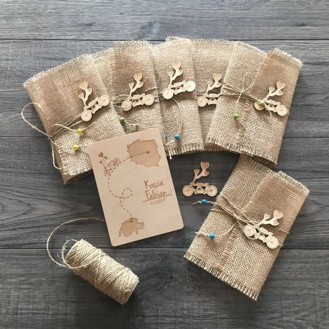 Laser-engraved wooden wedding invitation and rustic decorations made with Trotec Speedy series laser cutter