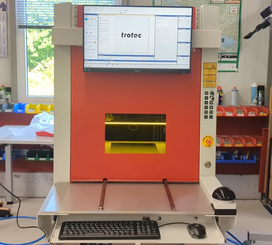 Trotec SpeedMarker laser marking machine with Ruby software interface on screen