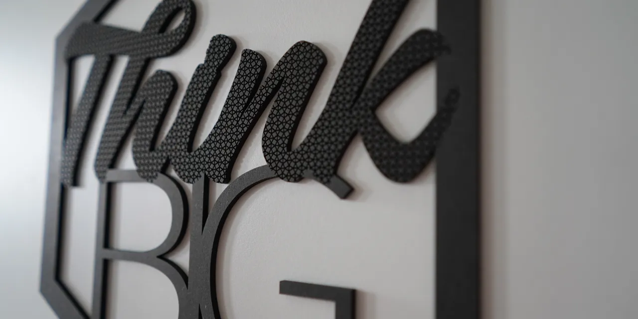 Laser-cut and engraved Think Big wall sign made with Trotec CO₂ laser cutter