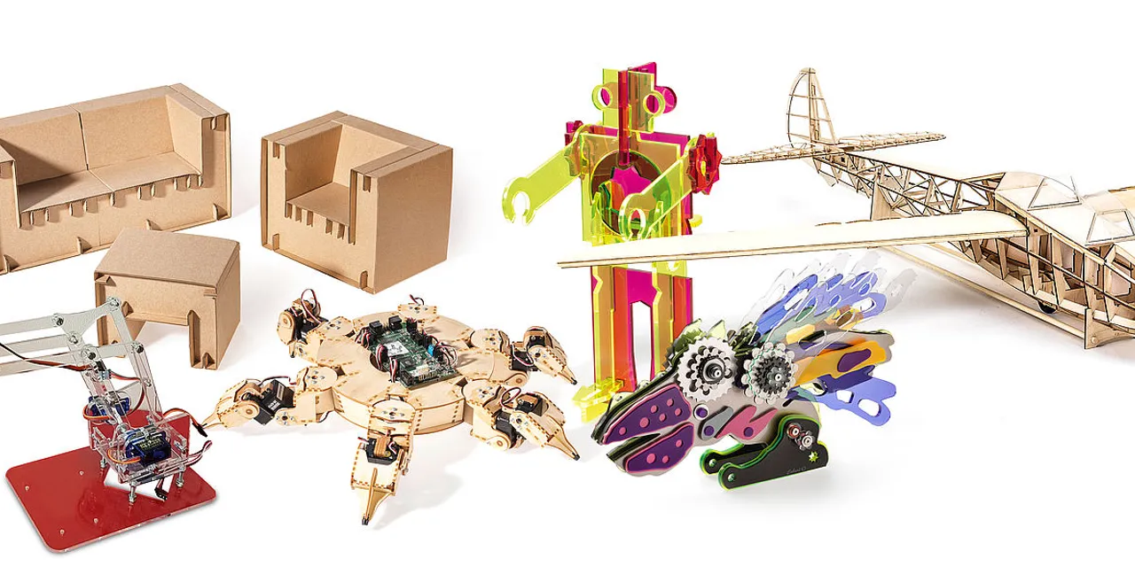 Laser-cut models and prototypes made with Trotec laser cutter including toys, furniture, and a model airplane