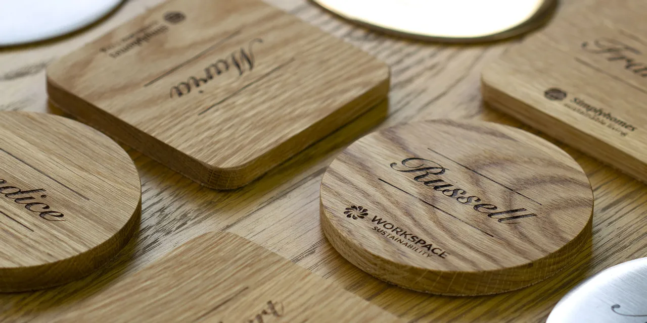 Custom engraved wooden coasters with names made using Trotec laser cutter