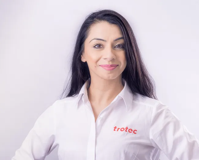 Trotec team member in branded shirt representing laser engraving technology company