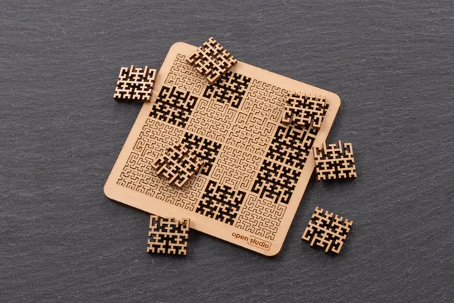 Laser-cut wooden puzzle with intricate patterns made using Trotec CO₂ laser cutter