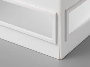 Close-up of precisely laser-cut white acrylic edge using Trotec CO₂ laser cutter