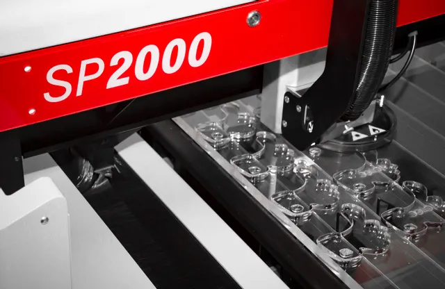 Trotec SP2000 laser cutter processing acrylic sheets with precision cutting technology