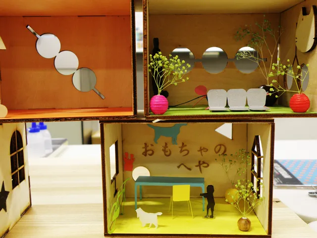 Miniature dollhouse interior made from laser-cut wood and paper using Trotec CO₂ laser cutter