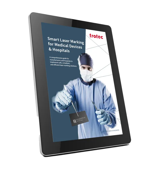 Trotec guide on laser marking for medical devices and hospitals displayed on digital tablet