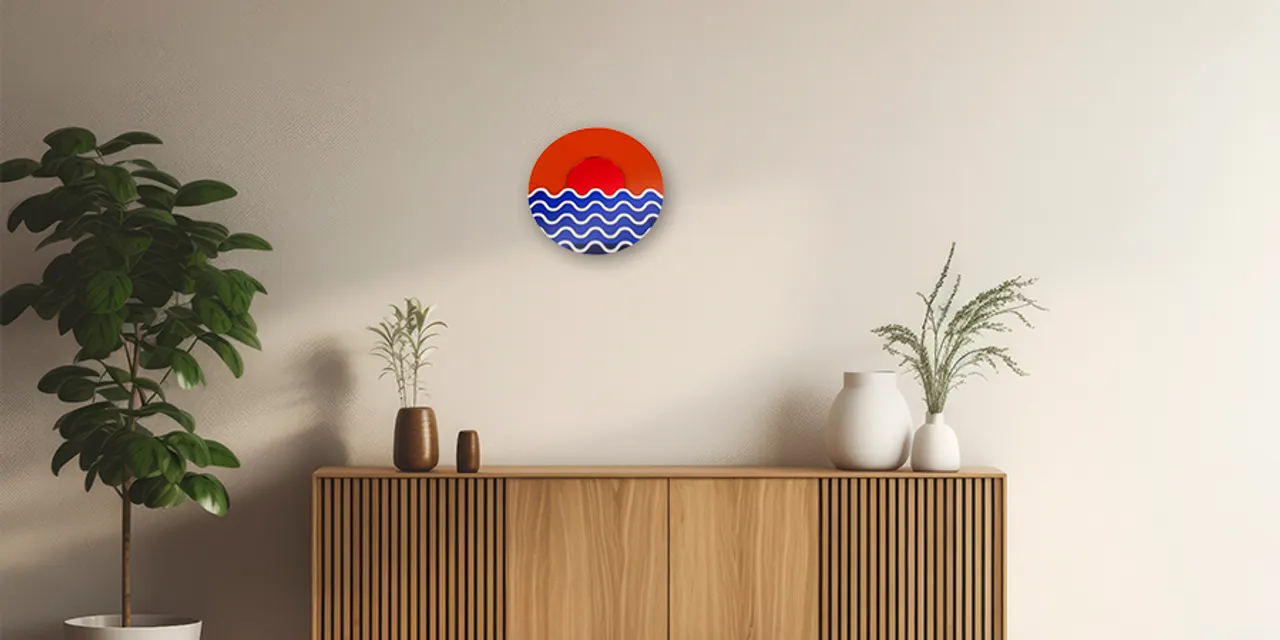Modern wooden sideboard with round laser-cut wall art made using Trotec CO₂ laser cutter