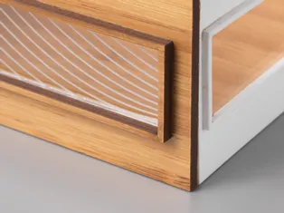 Acrylic and wood box detail with laser-cut edges and engraving made with Trotec CO₂ laser cutter