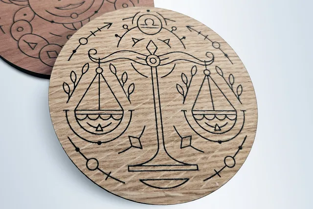 Wooden coasters with zodiac designs laser engraved using Trotec Speedy CO₂ laser cutter