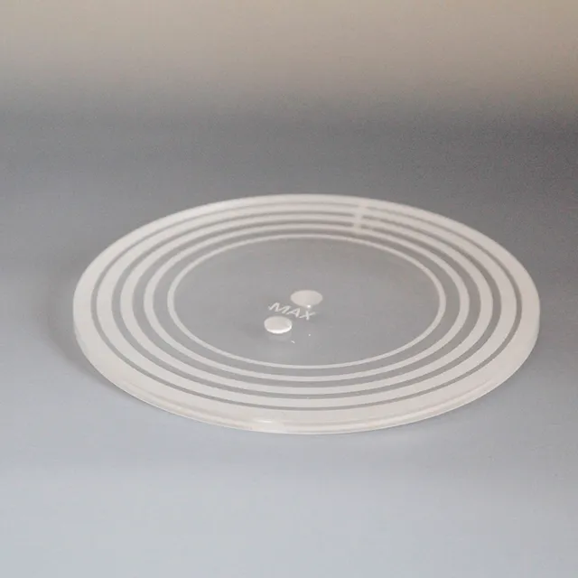 Clear acrylic disc with concentric circles and MAX marking engraved by Trotec CO₂ laser cutter